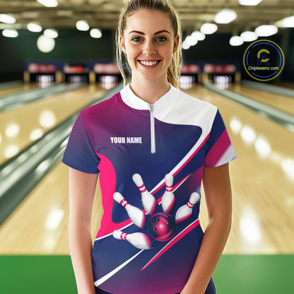 Female bowler wearing white, blue and pink bowling jersey during league play, custom bowling apparel for competitive athletes, bowling enthusiasts and women's sports teams, symbolizing confidence and sportsmanship.