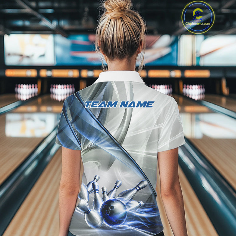 Female bowler wearing white and blue smoke bowling jersey during league competition, stylish bowling apparel for tournament players, bowling enthusiasts and sports clubs, symbolizing confidence, consistency and excellence.
