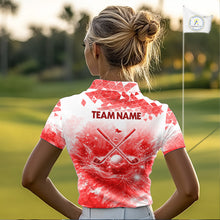 Load image into Gallery viewer, Female golfer wearing blue water splash golf polo shirt, golf ball golf apparel, women's golf outfit